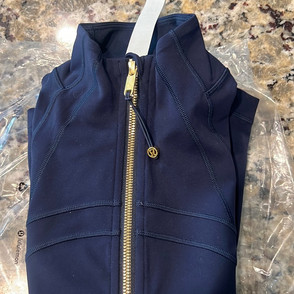 Navy blue and gold define jacket nulu
